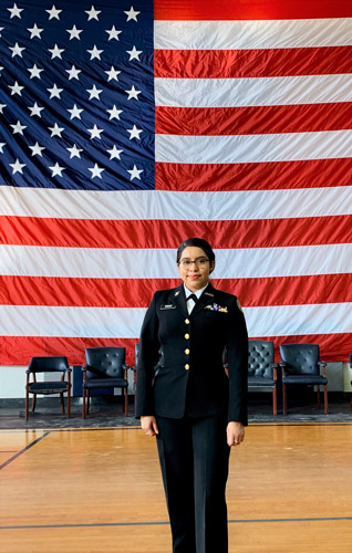 RNA_female-cadet-in-front-of-flag